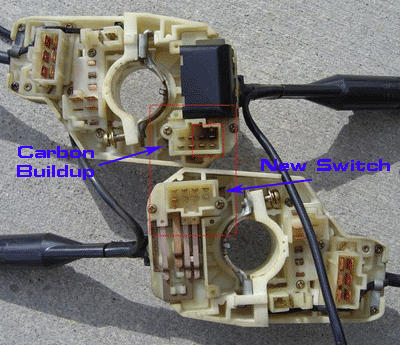 Damaged combination switch pin with carbon buildup